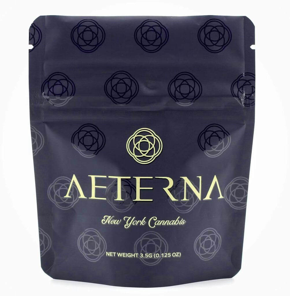 Aeterna New York Cannabis black packaging pouch with geometric pattern and gold text.