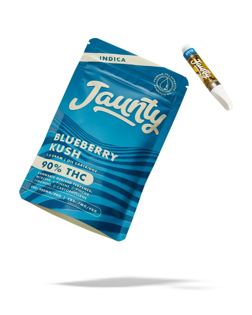 Blue Jaunty Blueberry Kush vape cartridge packaging with a cartridge floating beside it on a white background.