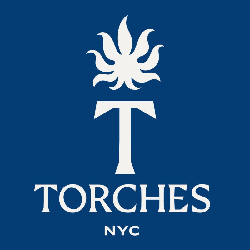White stylized torch and flame above TORCHES NYC on a blue background, representing The Best Cannabis Delivery in Each NYC Borough.