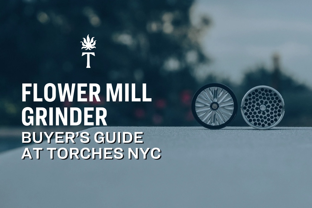 Two parts of a Flower Mill Grinder rest on a table with text: “Flower Mill Grinder Buyer’s Guide at Torches NYC.”.