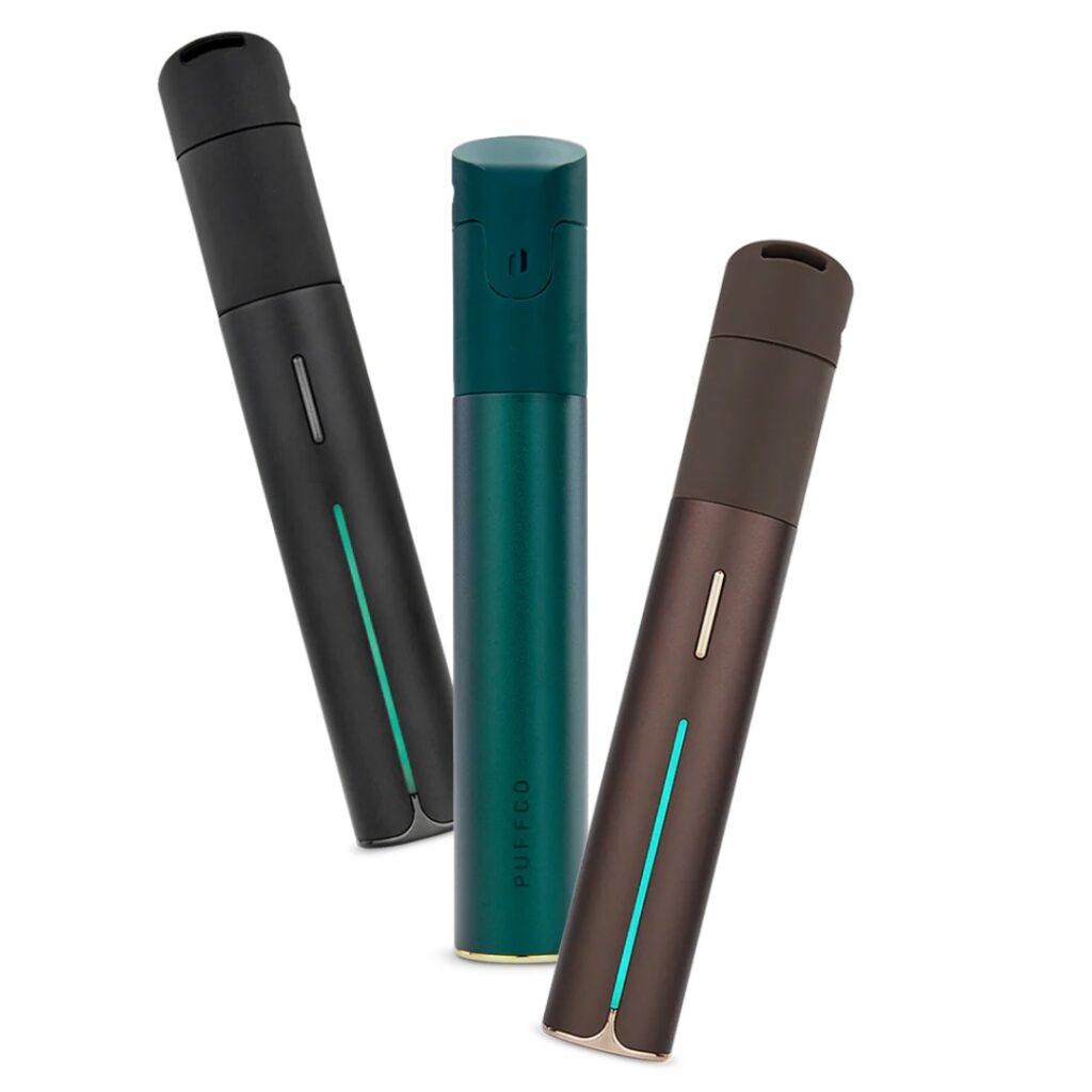 Three sleek, cylindrical vape pens in black, teal, and bronze, standing upright on a white background.
