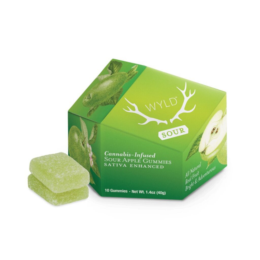 Green box of WYLD Sour Apple Cannabis-Infused Gummies with two green gummies beside the box—perfect for a tasty wake and bake start to your day.