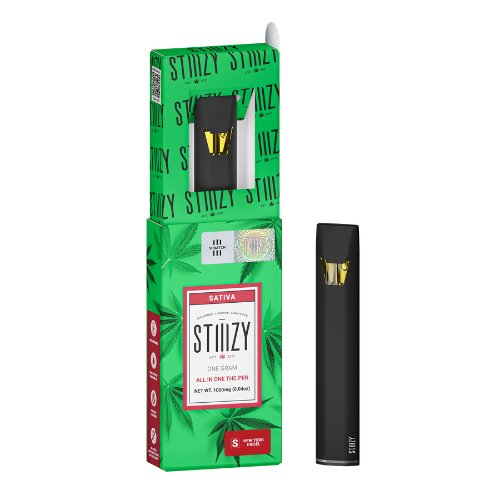 A STIIIZY cannabis vape pen and its green sativa box with leaf graphics, featuring bold STIIIZY branding.