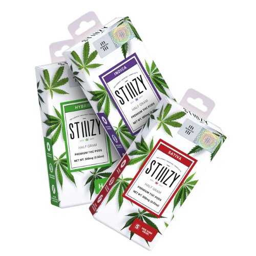 Three STIIIZY vape pod boxes labeled Hybrid, Indica, and Sativa, each featuring cannabis leaf designs and the iconic STIIIZY branding.