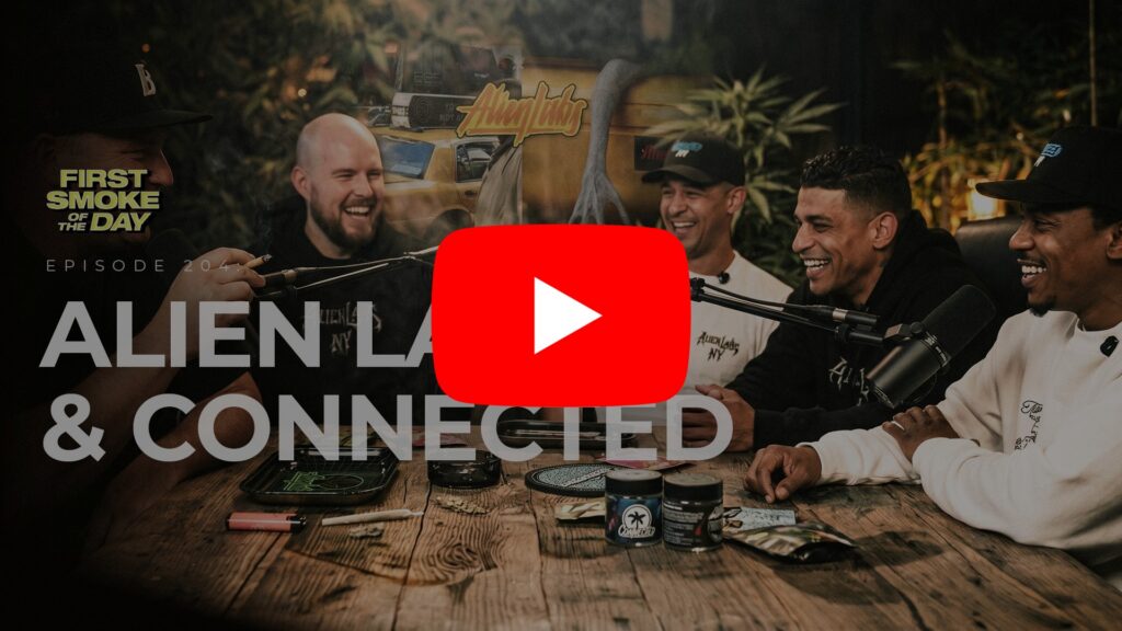 Five men sit around a table laughing during a podcast recording, with Connected Cannabis products on the table.