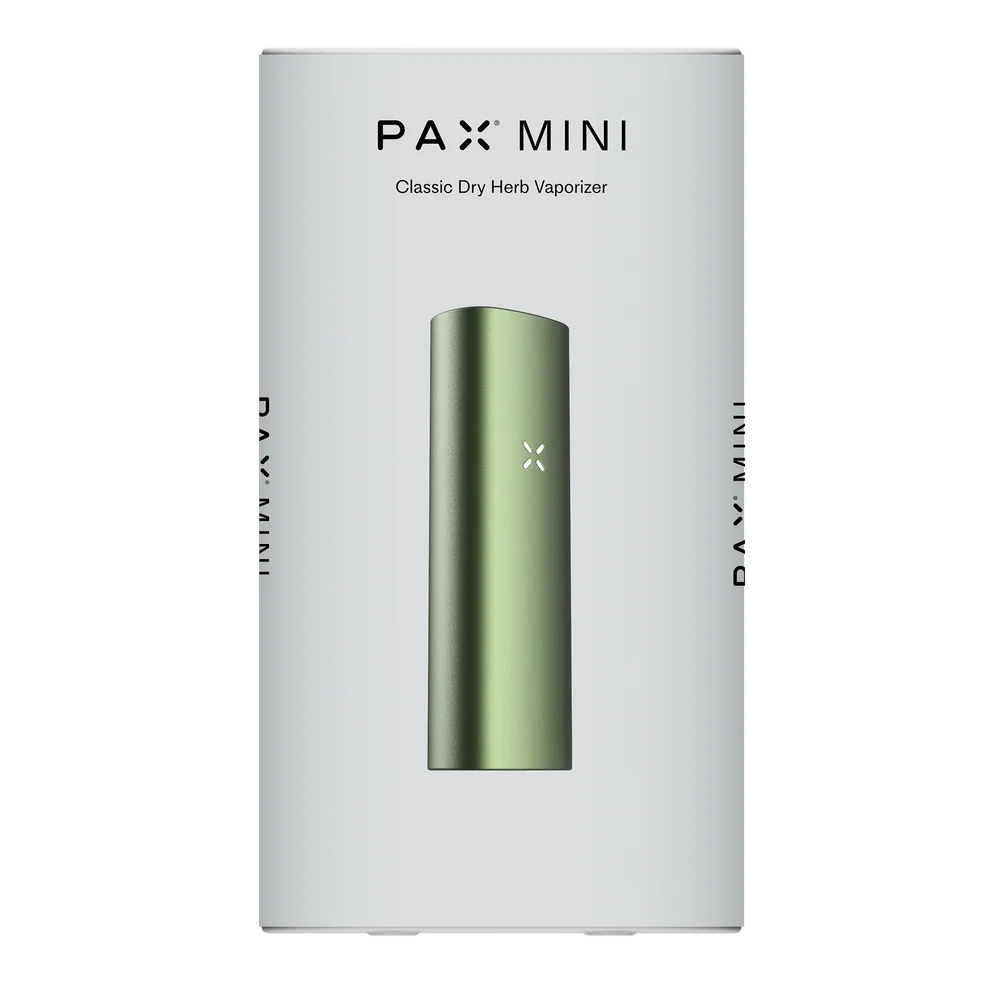 A green PAX Mini dry herb vaporizer displayed upright on its white product packaging.