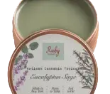 A tin of Eucalyptus + Sage scented candle with a green wax and floral label, inspired by the fresh ambiance of Torches NYC.