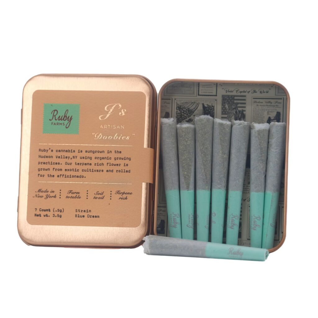 Open tin labeled Ruby Farms with seven cannabis pre-rolls inside, one laying in front, on white background.